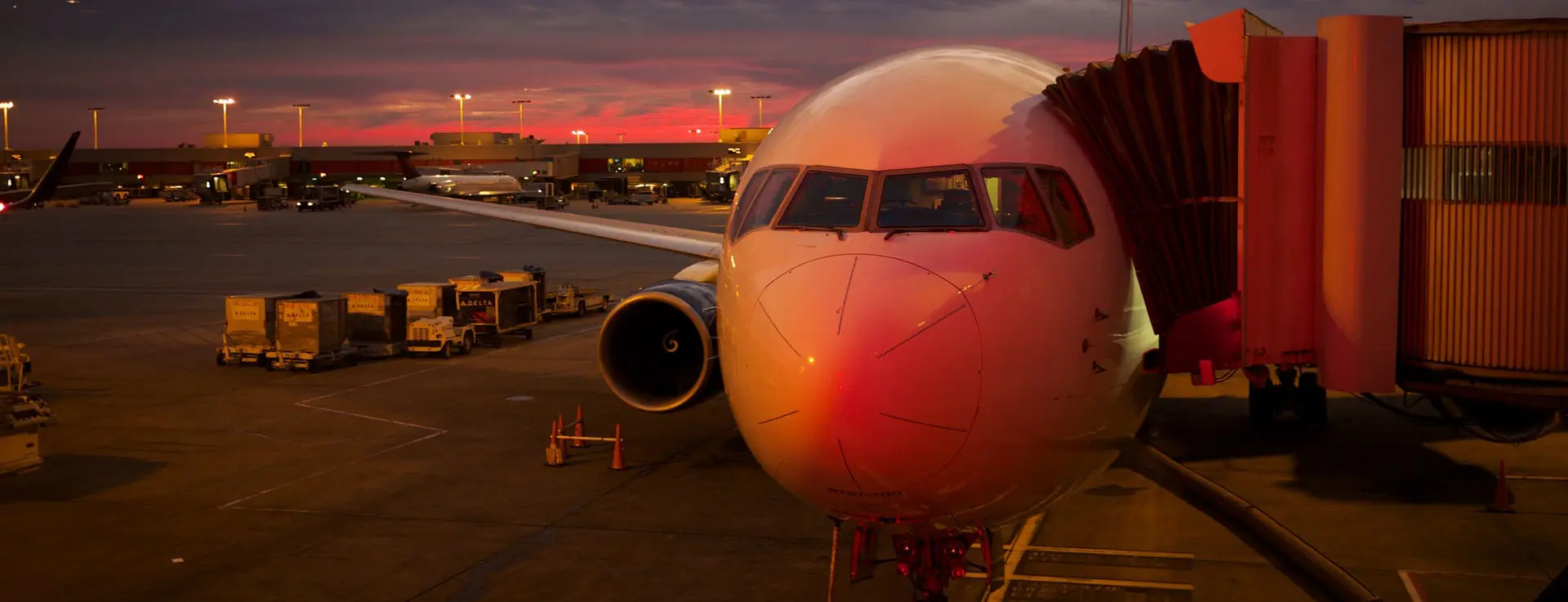 A large airplane parked at an airport terminal.